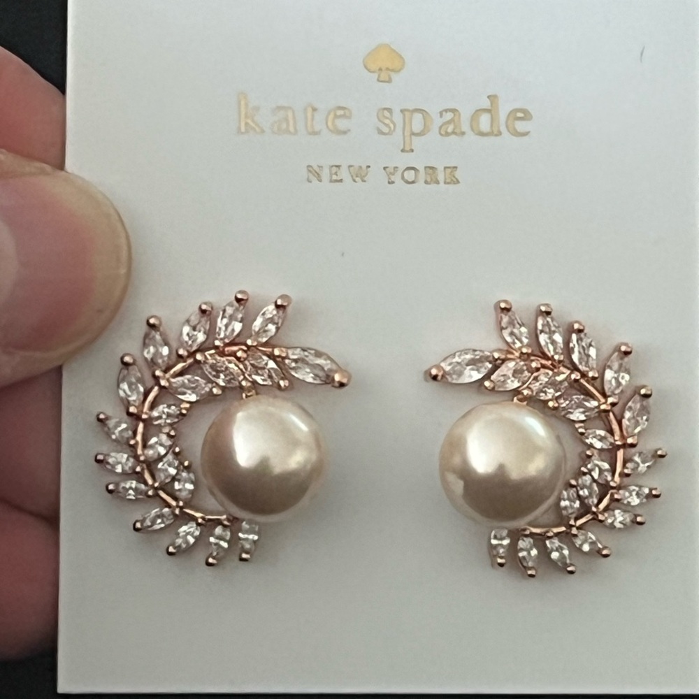 New Kate spade Pearl earrings 
Surrounded by swarovski elements